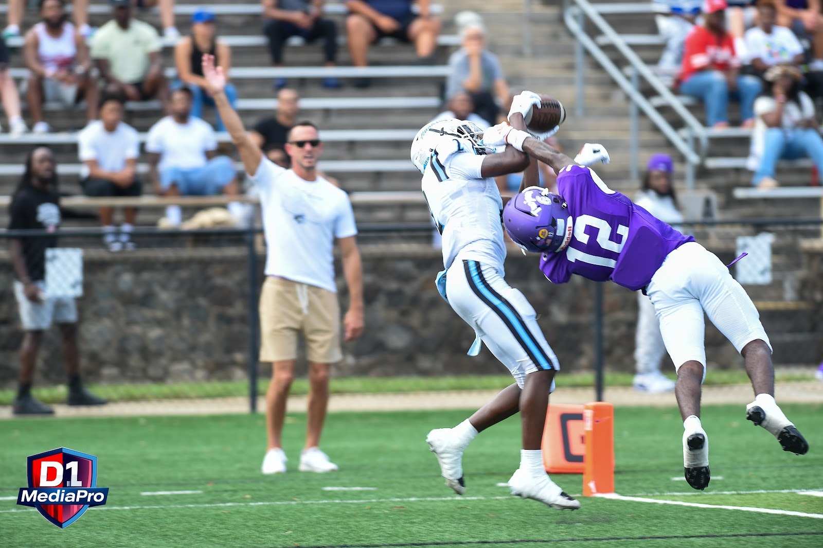 Hough receiver makes a contested catch at the pylon